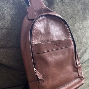 Coach Charles Messenger Brown Leather sling pack bag.